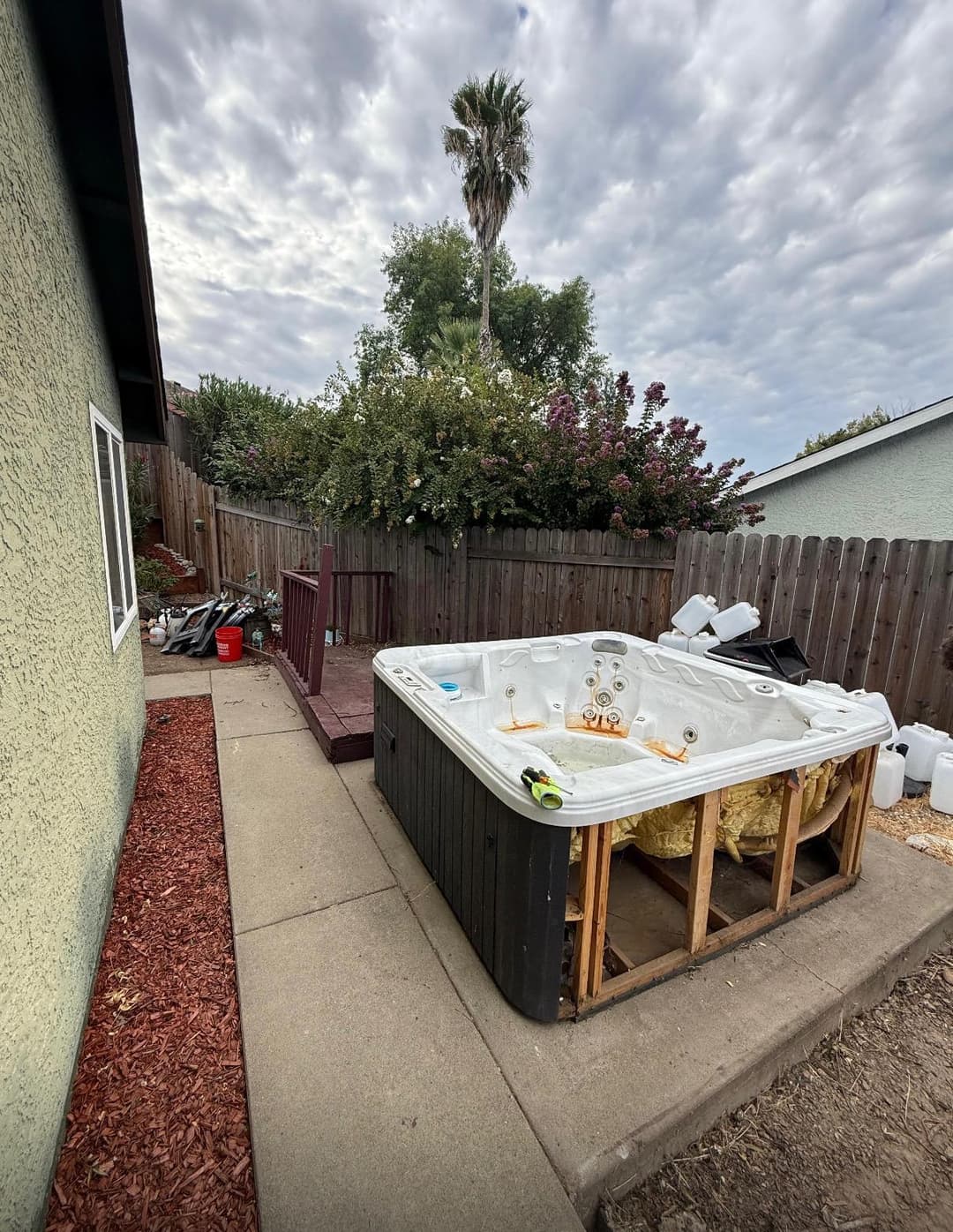 Hot tub in Sacramento backyard about to be removed by junk hauling company