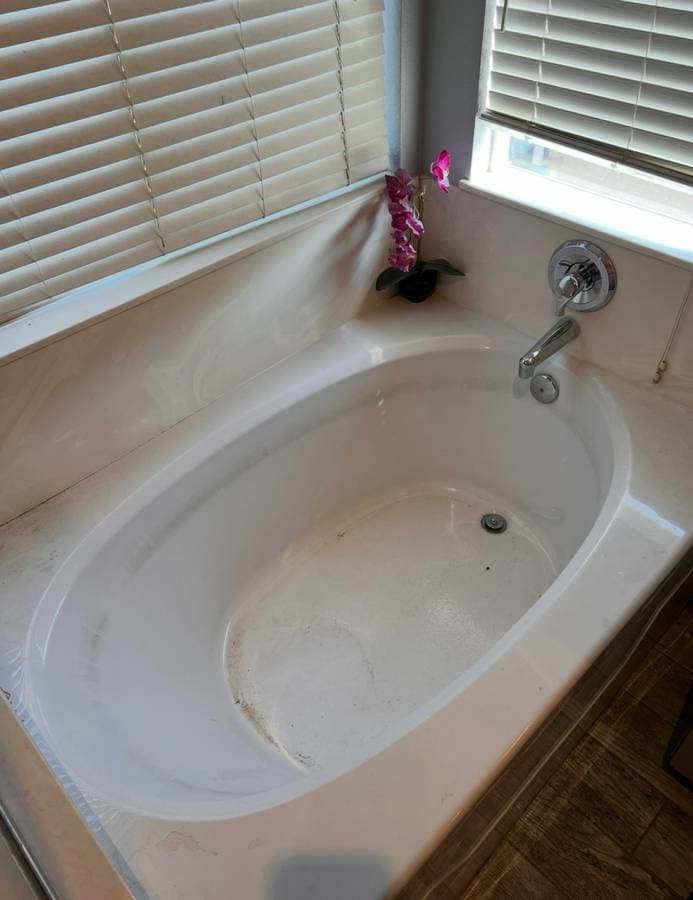 Dirty bathtub before junk removal and bathroom cleanup service in Sacramento California